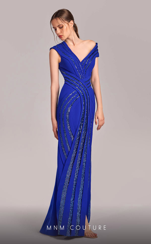 MNM Couture Style G1833 royal blue rayon crepe column gown featuring a pleated bust, asymmetric V-neckline, off-shoulder strap sleeve, and elegant slit above the knee