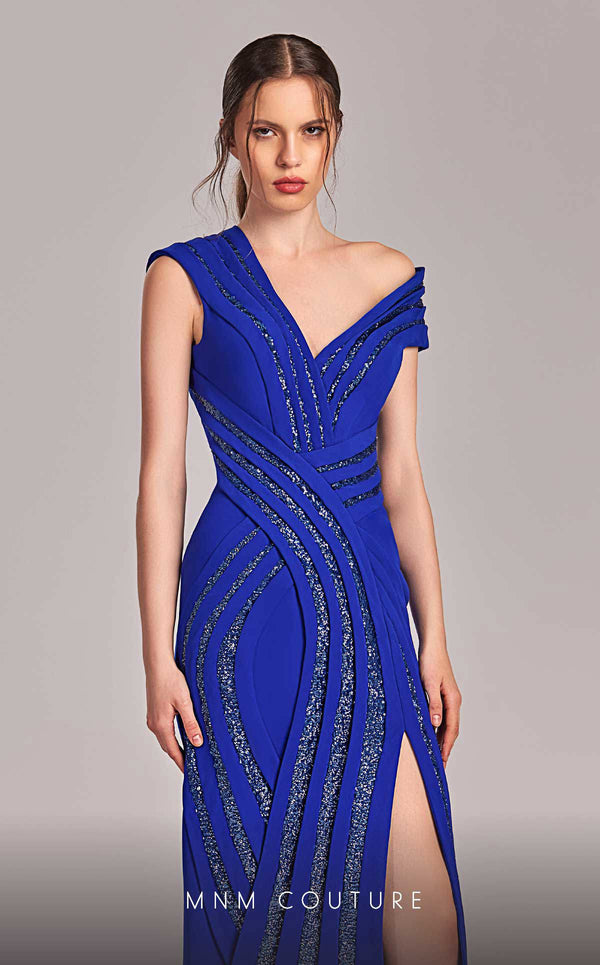 MNM Couture Style G1833 royal blue rayon crepe column gown featuring a pleated bust, asymmetric V-neckline, off-shoulder strap sleeve, and elegant slit above the knee