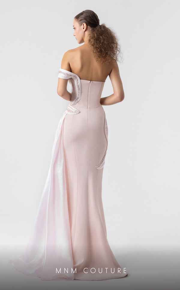 MNM Couture G1900 blush pink gown with off-shoulder silhouette and sculptural holographic draping. | Couture Shop LA