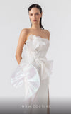 MNM Couture G1903 pearly off-white holographic gown with cascading peplum and high-slit detailing. | Couture Shop LA