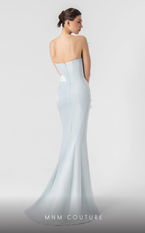 MNM Couture G1904 strapless mint blue mermaid gown with feather and holographic pleated organza detailing. | Couture Shop LA