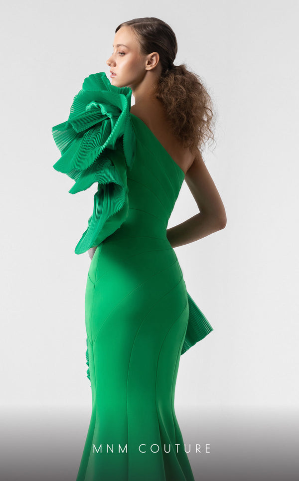 MNM Couture G1918 emerald green mermaid gown with bold one-sleeve ruffle detailing. | Couture Shop LA