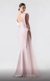 MNM Couture G1929 pink gown with asymmetrical pleats and flowing fabric for an elegant and timeless look. | Couture Shop LA