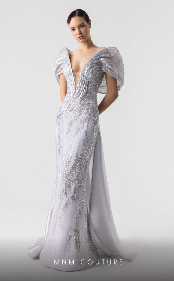 MNM Couture G1939 silver lace gown with off-shoulder details and shimmering embellishments. | Couture Shop LA
