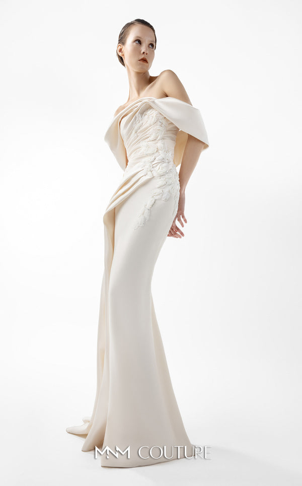 MNM Couture Style G2007 showcasing a cream crepe gown with dramatic off-shoulder satin sleeves, exquisite handmade embroidery on the bodice, and subtle thigh-high slit | Couture Shop LA