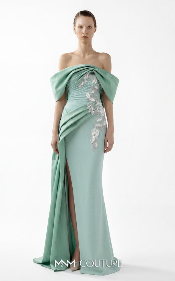 MNM Couture Style G2007 showcasing a cream crepe gown with dramatic off-shoulder satin sleeves, exquisite handmade embroidery on the bodice, and subtle thigh-high slit | Couture Shop LA