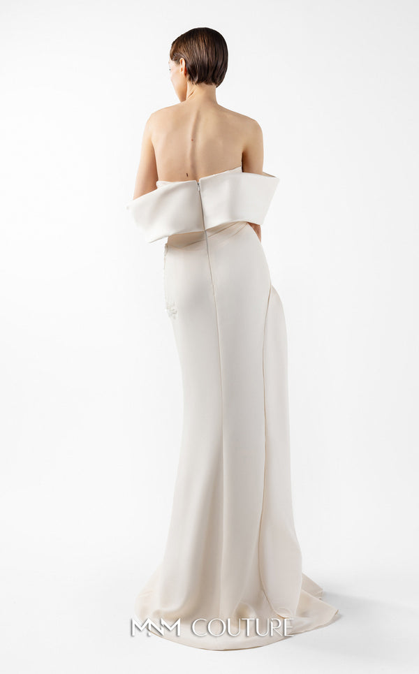 MNM Couture Style G2007 showcasing a cream crepe gown with dramatic off-shoulder satin sleeves, exquisite handmade embroidery on the bodice, and subtle thigh-high slit | Couture Shop LA