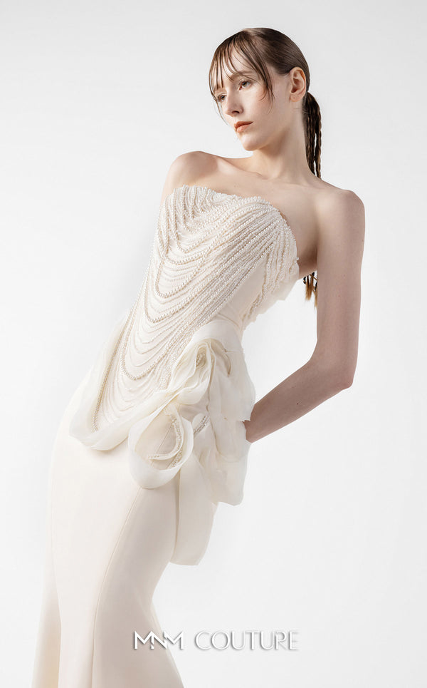 MNM Couture Style G2015 showcasing a cream strapless mermaid gown with pearl lace bodice detailing and sculptural organza inserts blooming at the hip | Couture Shop LA
