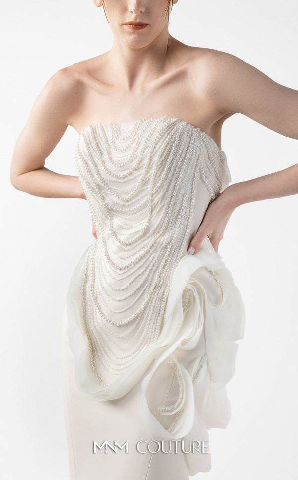 MNM Couture Style G2015 showcasing a cream strapless mermaid gown with pearl lace bodice detailing and sculptural organza inserts blooming at the hip | Couture Shop LA