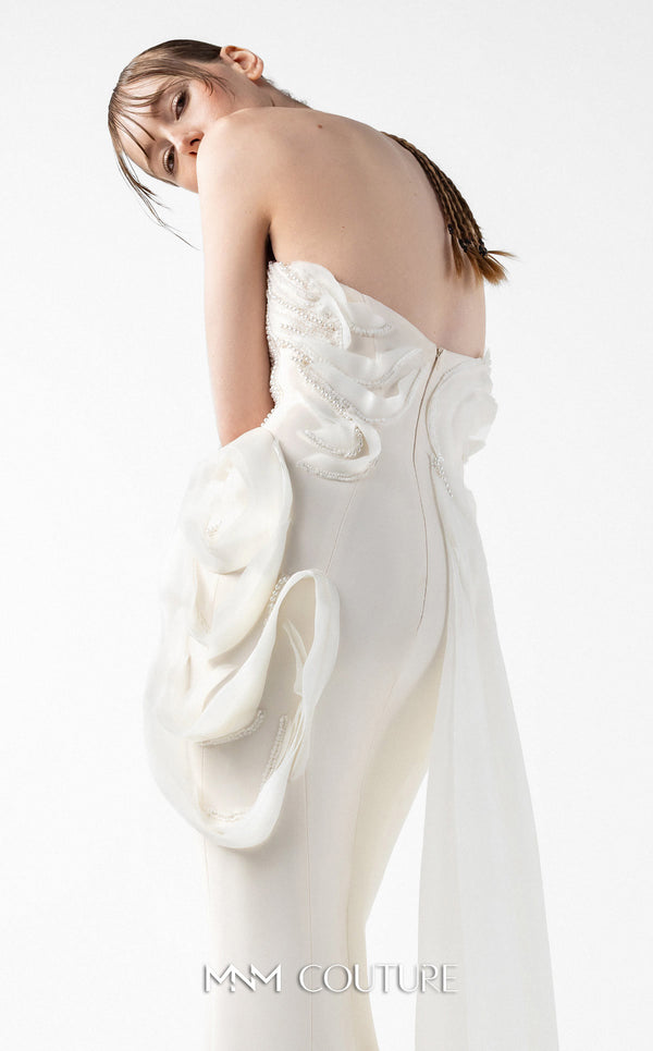 MNM Couture Style G2015 showcasing a cream strapless mermaid gown with pearl lace bodice detailing and sculptural organza inserts blooming at the hip | Couture Shop LA
