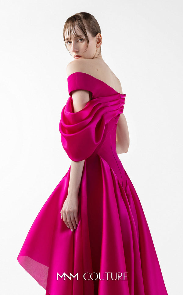 MNM Couture G2018 off-shoulder crepe and satin A-line gown with asymmetrical straight-across neckline, bust draping, and cascading pleated satin overskirt | Couture Shop LA.