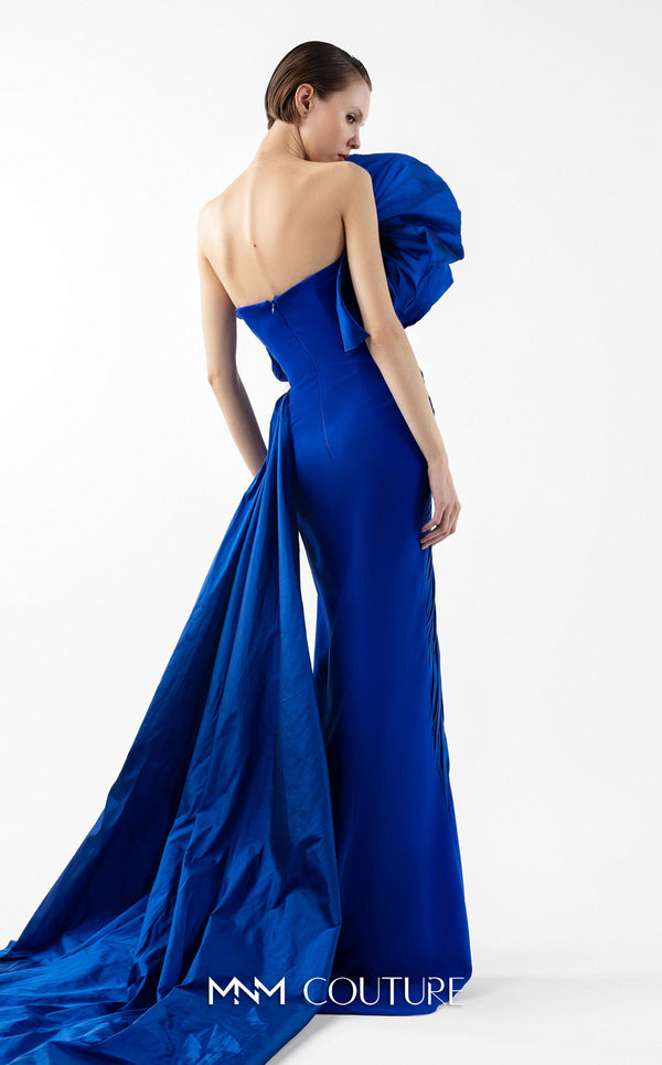 MNM Couture Style G2019 showcasing a royal blue strapless gown with sculptural taffeta draping cascading from bustline to hem, featuring architectural design and dramatic side train | Couture Shop LA