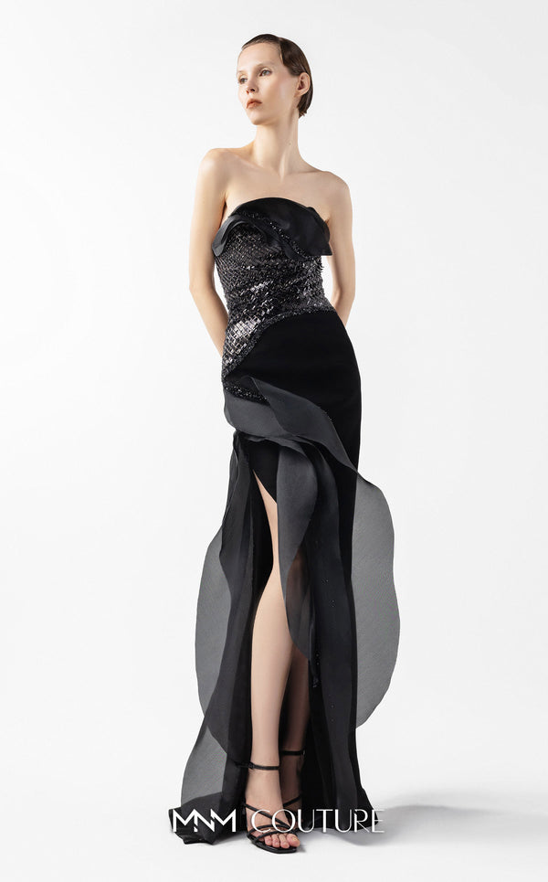 MNM Couture Style G2021 showcasing a strapless black gown with asymmetrical lace, flowing organza panels, and a dramatic high slit | Couture Shop LA.
