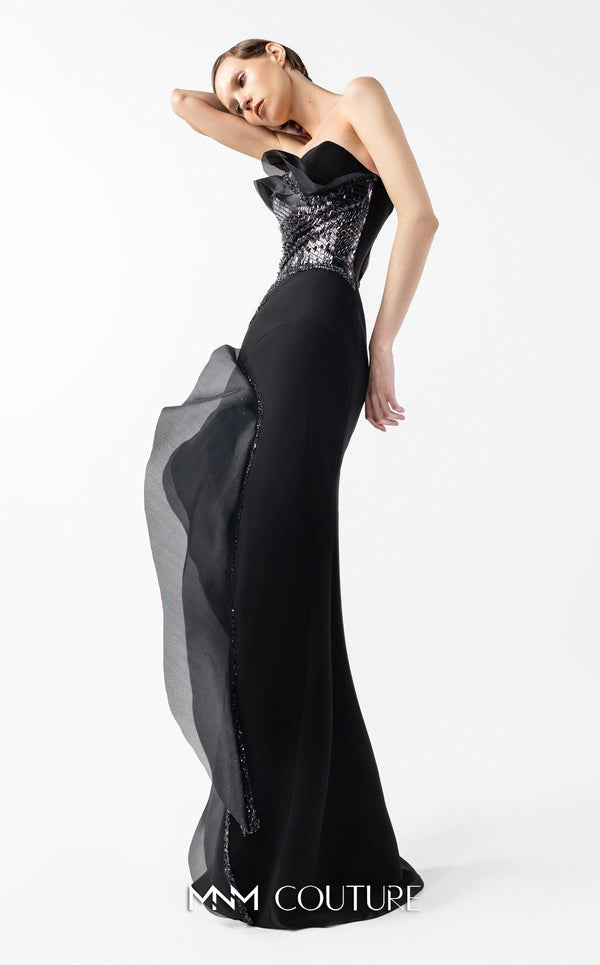 MNM Couture Style G2021 showcasing a strapless black gown with asymmetrical lace, flowing organza panels, and a dramatic high slit | Couture Shop LA.
