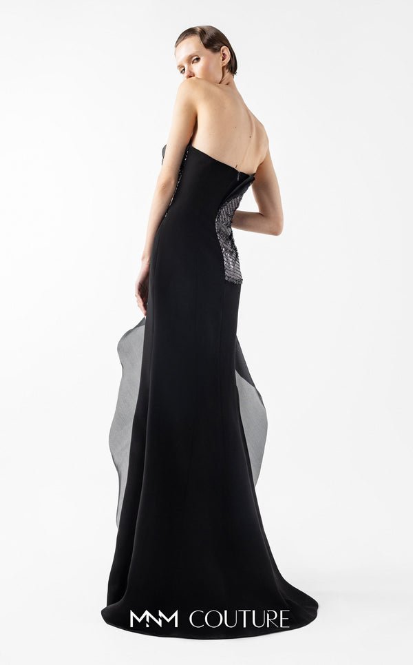 MNM Couture Style G2021 showcasing a strapless black gown with asymmetrical lace, flowing organza panels, and a dramatic high slit | Couture Shop LA.