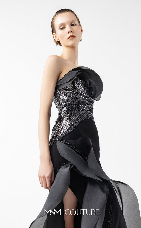 MNM Couture Style G2021 showcasing a strapless black gown with asymmetrical lace, flowing organza panels, and a dramatic high slit | Couture Shop LA.