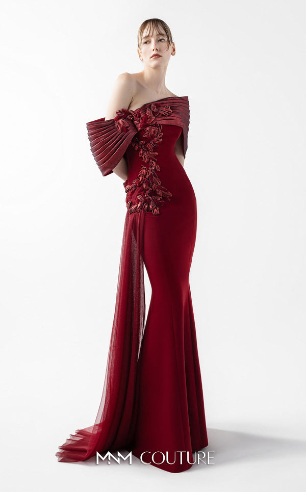 MNM Couture Style G2022 showcasing a burgundy mermaid gown with pleated lamé organza shoulders, intricate embroidery, and a tulle train | Couture Shop LA