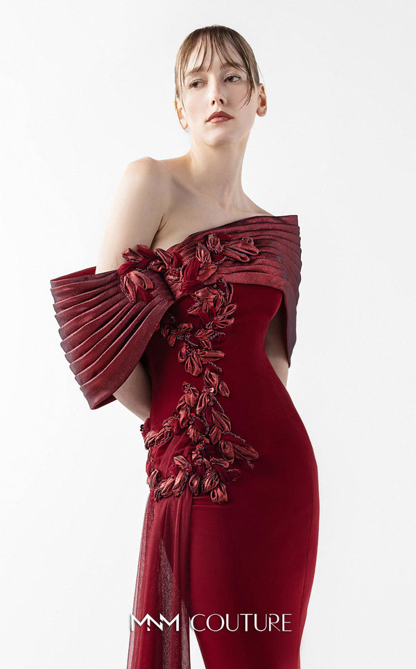 MNM Couture Style G2022 showcasing a burgundy mermaid gown with pleated lamé organza shoulders, intricate embroidery, and a tulle train | Couture Shop LA
