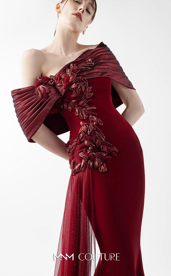 MNM Couture Style G2022 showcasing a burgundy mermaid gown with pleated lamé organza shoulders, intricate embroidery, and a tulle train | Couture Shop LA