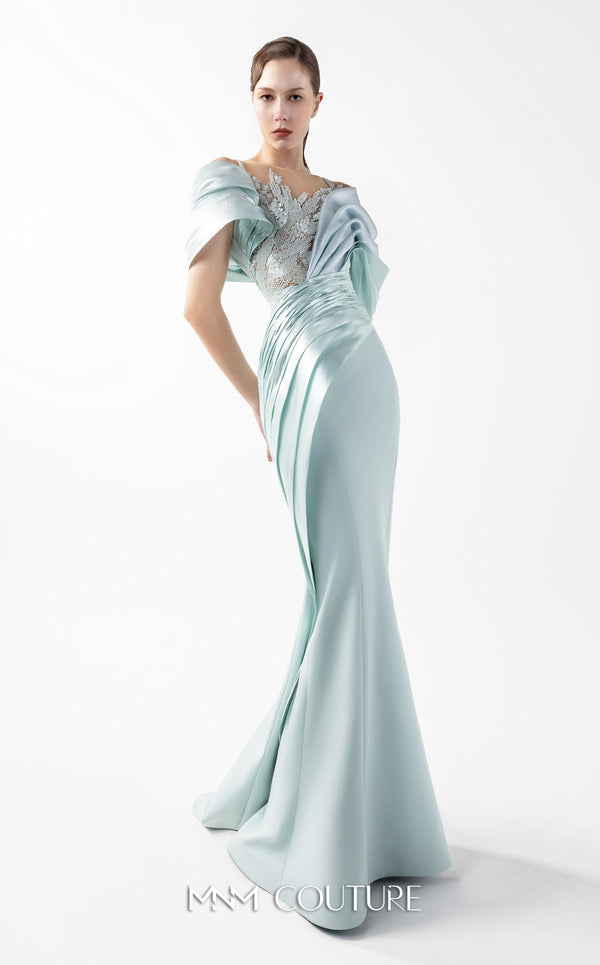 MNM Couture Style G2024 showcasing a mint blue mermaid gown with lace illusion bodice, metallic off-shoulder draping, and sculpted silhouette | Couture Shop LA