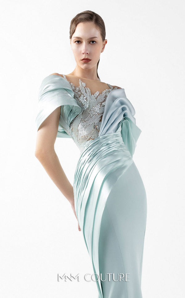 MNM Couture Style G2024 showcasing a mint blue mermaid gown with lace illusion bodice, metallic off-shoulder draping, and sculpted silhouette | Couture Shop LA