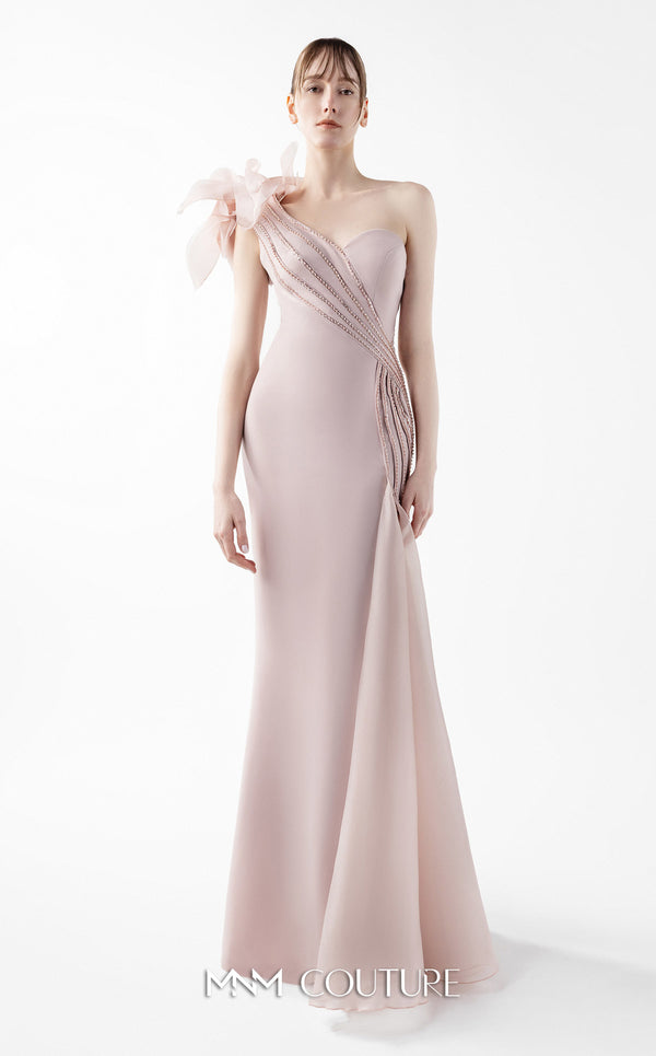MNM Couture Style G2026 showcasing a blush crepe gown with organza floral accent, lace embellishments, and a side train | Couture Shop LA