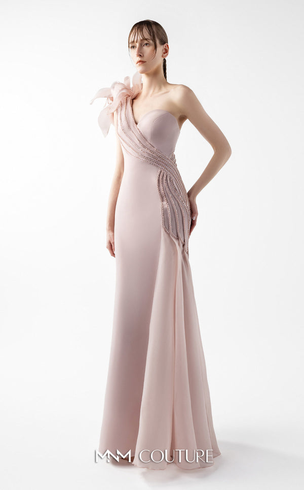 MNM Couture Style G2026 showcasing a blush crepe gown with organza floral accent, lace embellishments, and a side train | Couture Shop LA