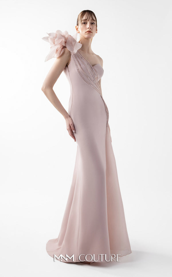 MNM Couture Style G2026 showcasing a blush crepe gown with organza floral accent, lace embellishments, and a side train | Couture Shop LA