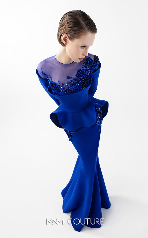 MNM Couture Style G2029 showcasing a royal blue mermaid crepe gown with illusion tulle neckline, intricate hand embroidery, long sleeves, and peplum waist detail | Couture Shop LA