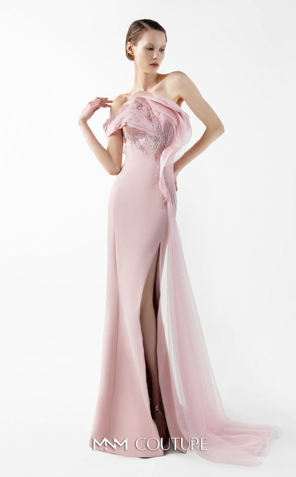 MNM Couture Style G2031 showcasing a pink mermaid gown with an embellished off-shoulder, intricate lace detailing, an alluring open slit, and a delicate tulle train | Couture Shop LA