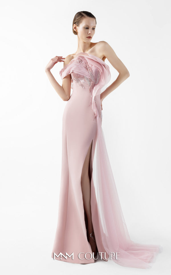 MNM Couture Style G2031 showcasing a pink mermaid gown with an embellished off-shoulder, intricate lace detailing, an alluring open slit, and a delicate tulle train | Couture Shop LA