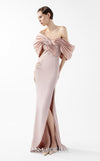MNM Couture Style G2034 showcasing a salmon blush crepe gown with metallic off-shoulder neckline, delicate lace and tulle side embellishments, and a dramatic high slit | Couture Shop LA