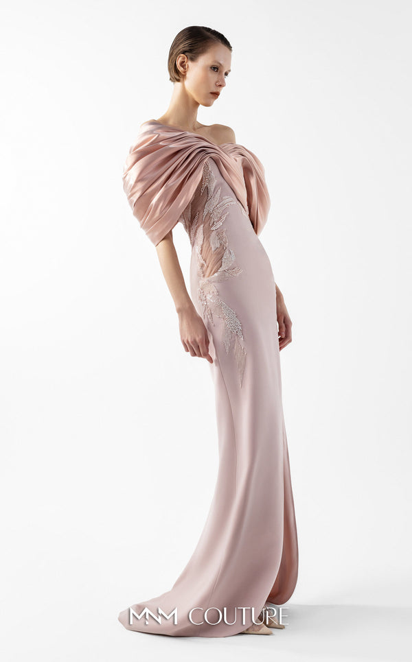 MNM Couture Style G2034 showcasing a salmon blush crepe gown with metallic off-shoulder neckline, delicate lace and tulle side embellishments, and a dramatic high slit | Couture Shop LA