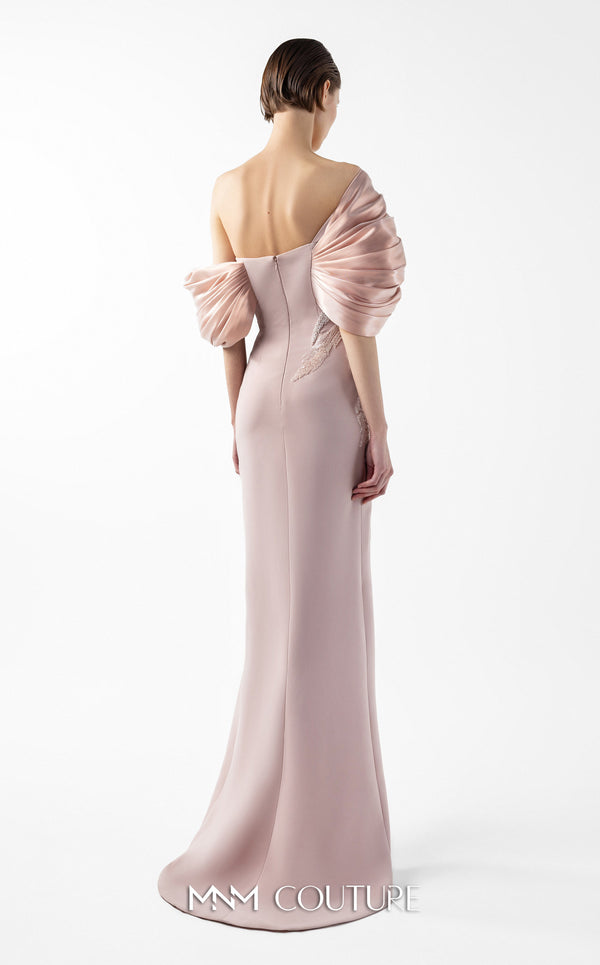 MNM Couture Style G2034 showcasing a salmon blush crepe gown with metallic off-shoulder neckline, delicate lace and tulle side embellishments, and a dramatic high slit | Couture Shop LA