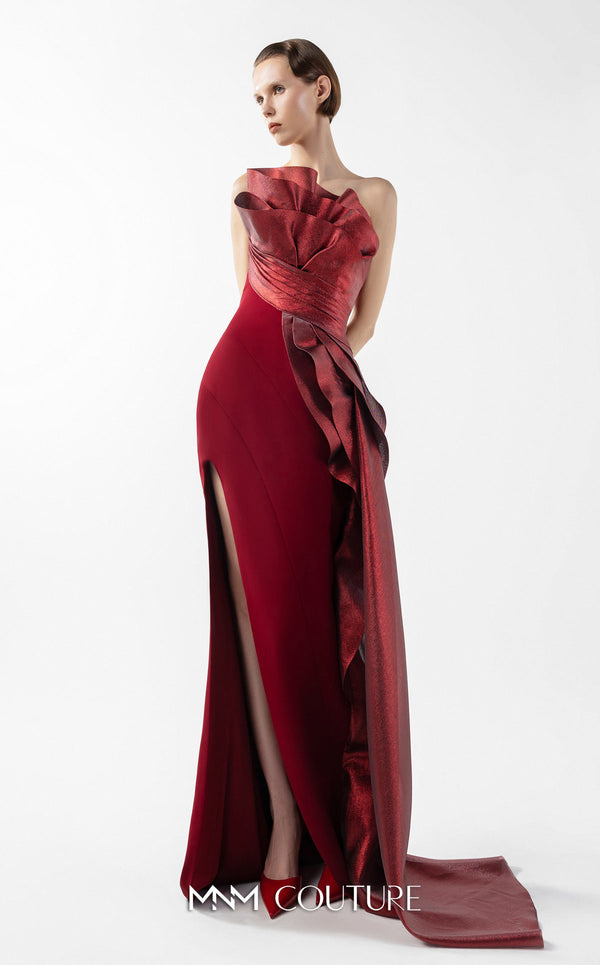 MNM Couture Style G2037 showcasing a strapless burgundy crepe gown with a sculpted, layered lamé organza bodice, a flowing train, and a high slit. | Couture Shop LA
