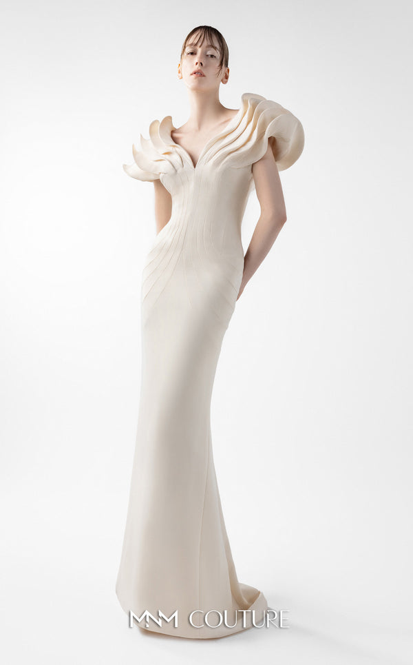 MNM Couture Style G2039 showcasing a cream mermaid gown with dramatic layered petal-like sleeves, sculptural shoulder detailing, and form-contouring silhouette with tonal paneling | Couture Shop LA