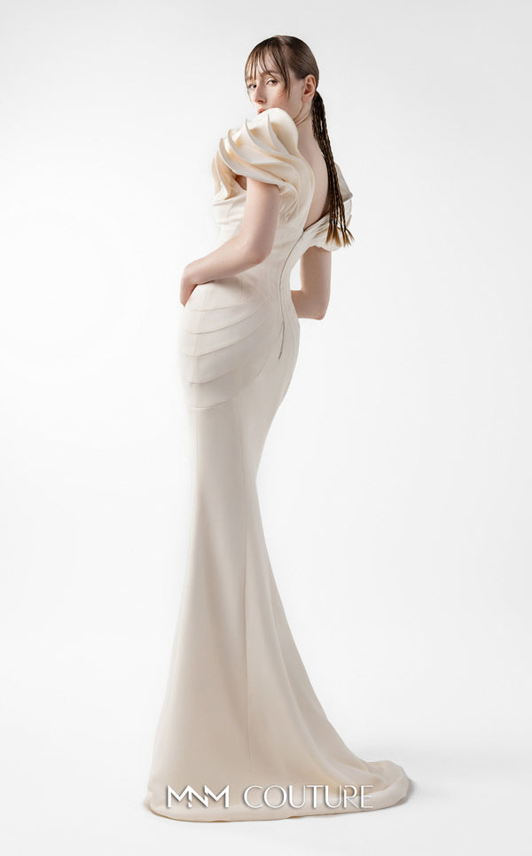 MNM Couture Style G2039 showcasing a cream mermaid gown with dramatic layered petal-like sleeves, sculptural shoulder detailing, and form-contouring silhouette with tonal paneling | Couture Shop LA