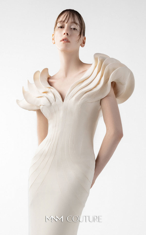 MNM Couture Style G2039 showcasing a cream mermaid gown with dramatic layered petal-like sleeves, sculptural shoulder detailing, and form-contouring silhouette with tonal paneling | Couture Shop LA