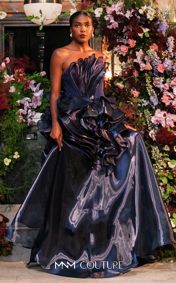 Strapless evening gown MNM Couture Style G2146 with cascading purple and navy fluid organza and a 3D floral waist bloom