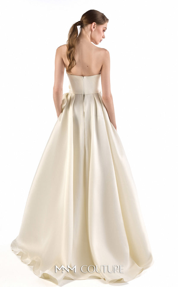 MNM Couture G2201 ivory organza and crystal mesh fitted column gown with strapless sweetheart neckline, hand-draped bodice, embroidered waist, and asymmetrical sculptural overskirt with cathedral train | Couture Shop LA.