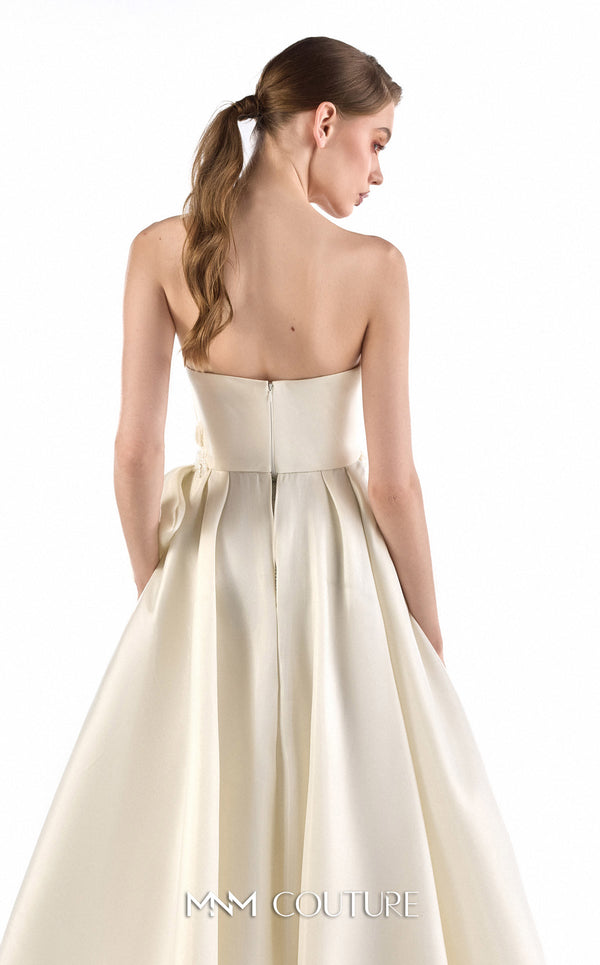 MNM Couture G2201 ivory organza and crystal mesh fitted column gown with strapless sweetheart neckline, hand-draped bodice, embroidered waist, and asymmetrical sculptural overskirt with cathedral train | Couture Shop LA.