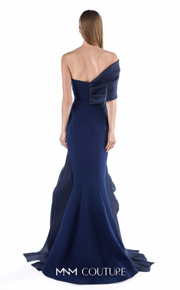 MNM Couture G2233 navy crepe and organza gommé asymmetrical off-shoulder mermaid gown with geometric asymmetric draping and layered cascading skirt | Couture Shop LA.