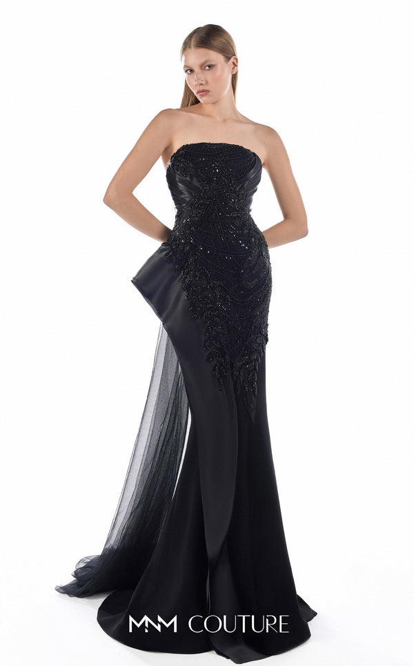 MNM Couture G2244 black beaded lace, organza, and tulle strapless fitted mermaid gown with sculpted neckline, architectural side peplum, and flowing tulle train | Couture Shop LA.