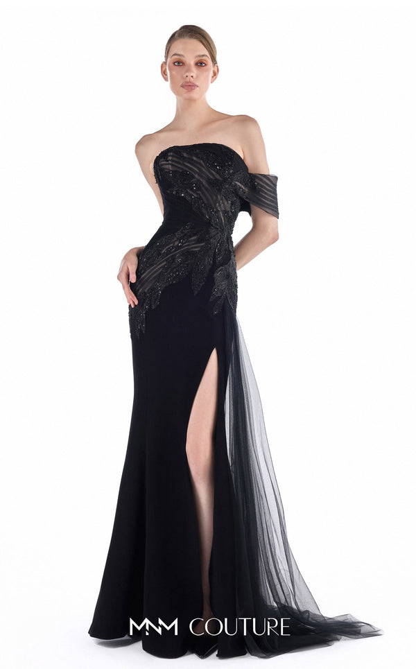 MNM Couture G2246 black beaded lace, crepe, and tulle off-shoulder sheath gown with sheer striped tulle detail, thigh-high front slit, and soft tulle train | Couture Shop LA.