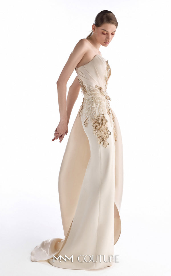 MNM Couture G2248 champagne crepe, lace, and crystal organza strapless column gown with sculpted bodice, hand-embroidered lace appliqués, draped crystal organza side panel, front slit, and sweeping train | Couture Shop LA.