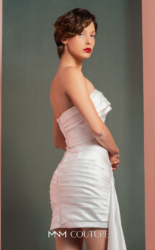 MNM Couture GOF2515 two-piece ensemble in white mikado piqué, featuring a strapless top with draped detailing and a matching high-waisted asymmetrical skirt with a cascading drape. | Couture Shop LA