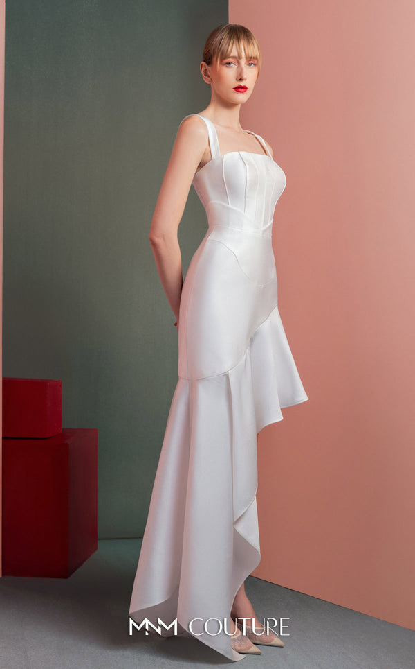 MNM Couture GOF2517 dress in white mikado piqué, featuring a structured bodice with thin straps and a gracefully flowing asymmetrical high-low skirt. | Couture Shop LA