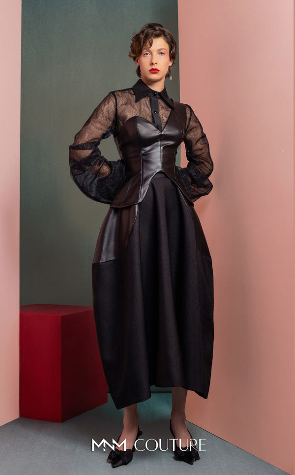 MNM Couture GOF2520 two-piece ensemble, featuring a black one-shoulder faux leather top and a matching black mikado piqué A-line skirt with leather side inserts. | Couture Shop LA