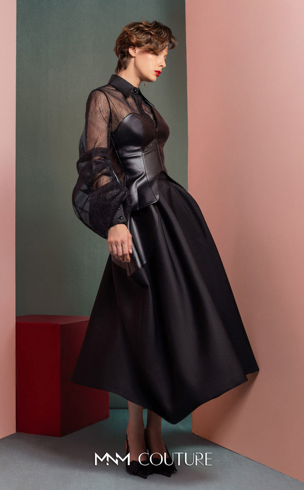 MNM Couture GOF2520 two-piece ensemble, featuring a black one-shoulder faux leather top and a matching black mikado piqué A-line skirt with leather side inserts. | Couture Shop LA