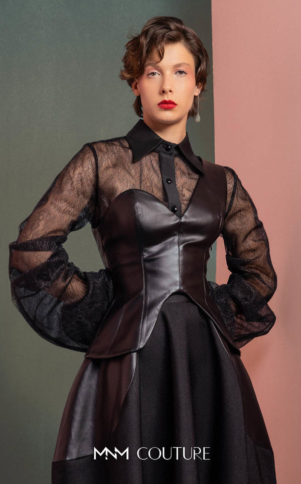 MNM Couture GOF2520 two-piece ensemble, featuring a black one-shoulder faux leather top and a matching black mikado piqué A-line skirt with leather side inserts. | Couture Shop LA